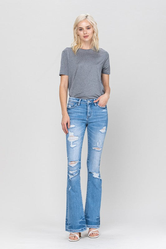 Jeans. DISTRESSED MID RISE FLARE