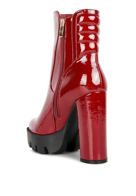 C. High Key Collared Patent High Heeled Ankle Boot